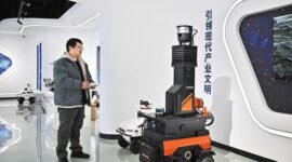 A staff member of Tianjin Siasun Intelligent Technology operates a mine inspection robot in the Beijing-Tianjin Zhongguancun Tech Town in Tianjin.